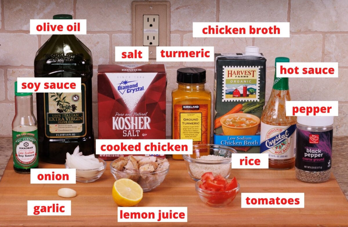 ingredients needed to make chicken and golden rice on a kitchen counter.