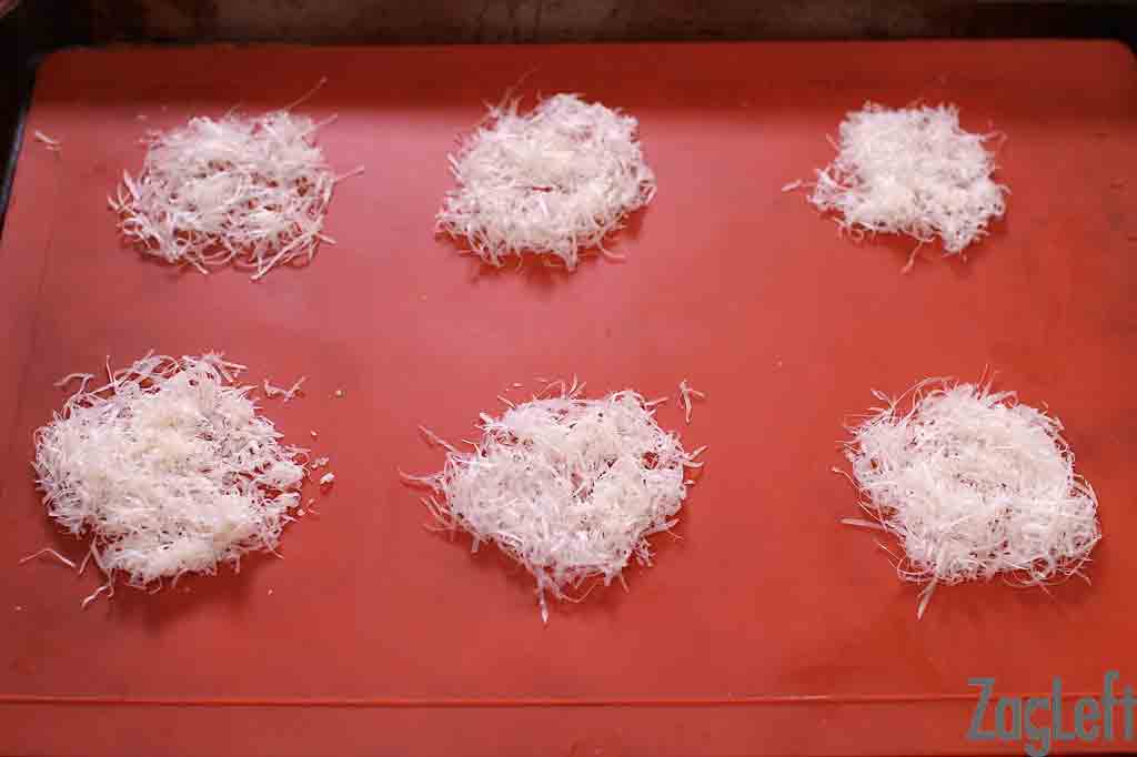 Balls of shredded parmesan cheese for Parmesan Crisps.