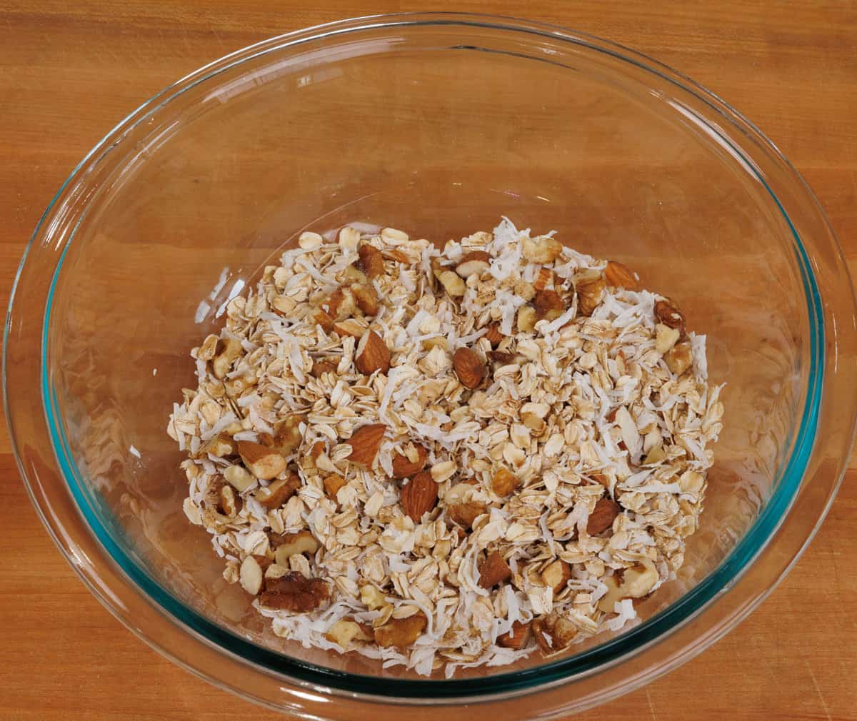 unbaked granola in a large mixing bowl.