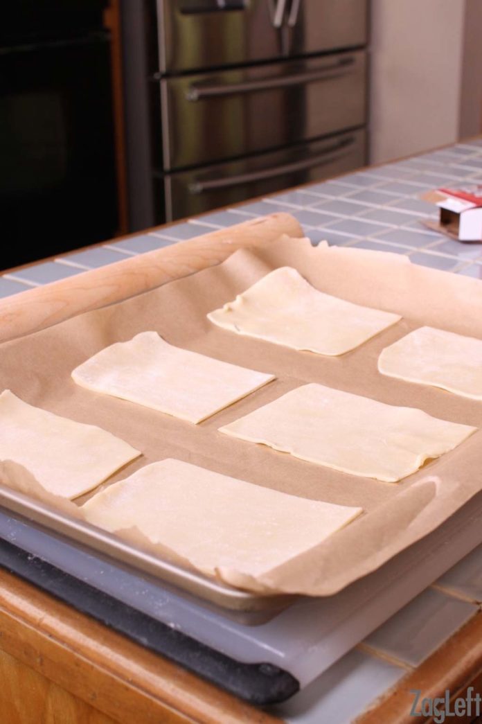 Cutting the refrigerator dough into six rectangles to make the bottom layer of homemade toaster pastries.