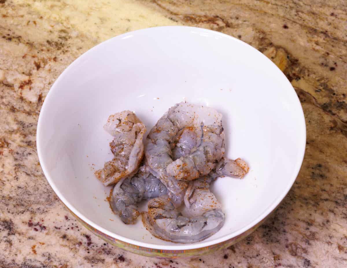 raw shrimp in a bowl on a kitchen counter