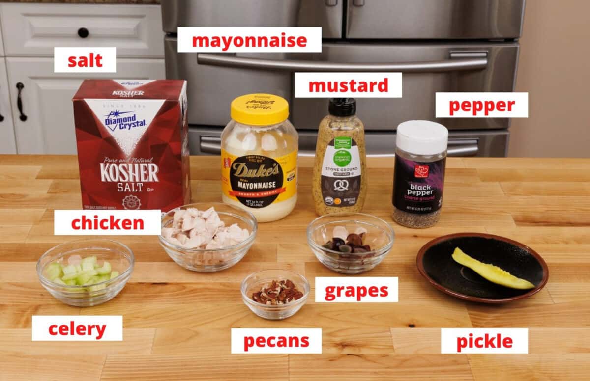 chicken salad ingredients on a cutting board in a kitchen