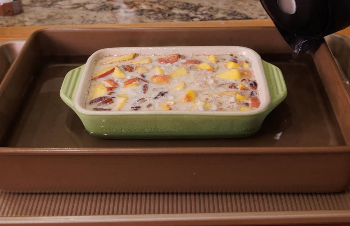 peach rice pudding in a water bath.