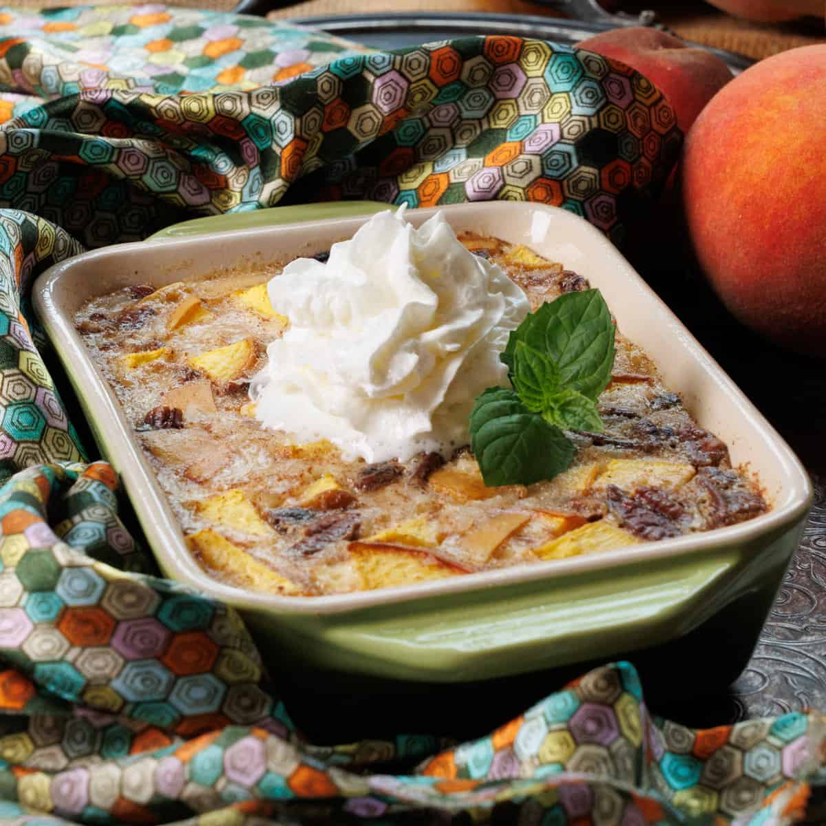 baked rice pudding with peaches and topped with whipped cream