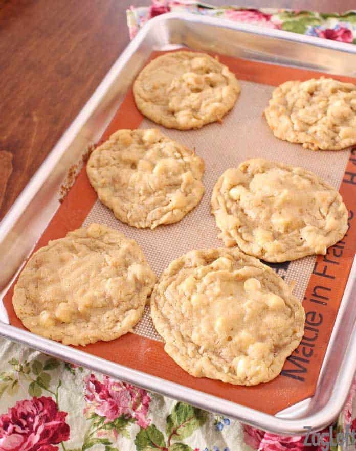 A tray of six tropical cookies on top of the floral napkin