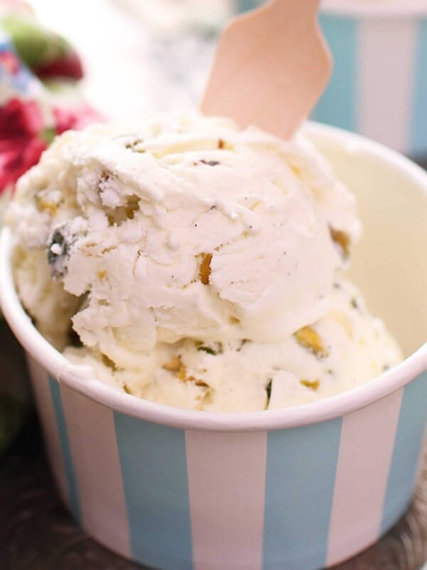 a small bowl of pistachio ice cream next to a floral napkin