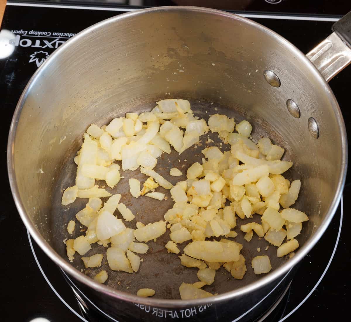 flour mixed with onions in a small pot