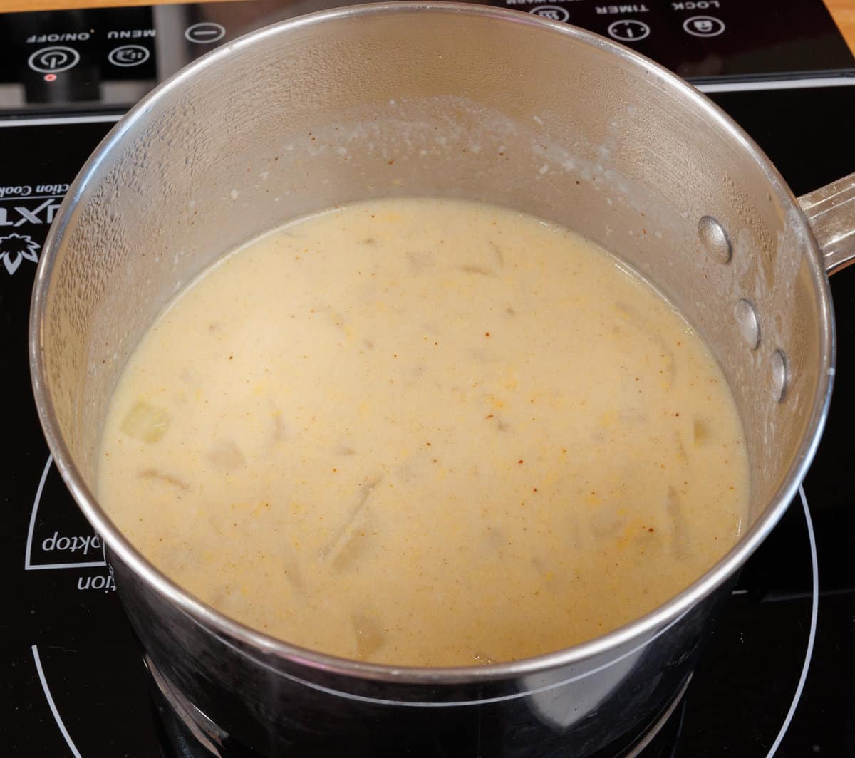 cheese soup simmering on a stove