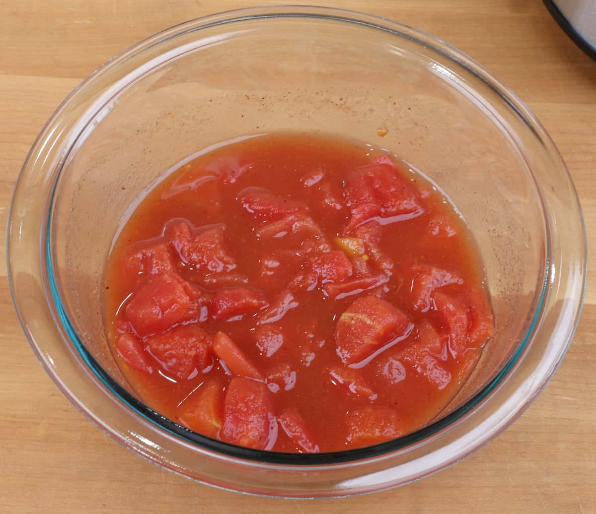 canned diced tomatoes and seasonings in a small bowl.