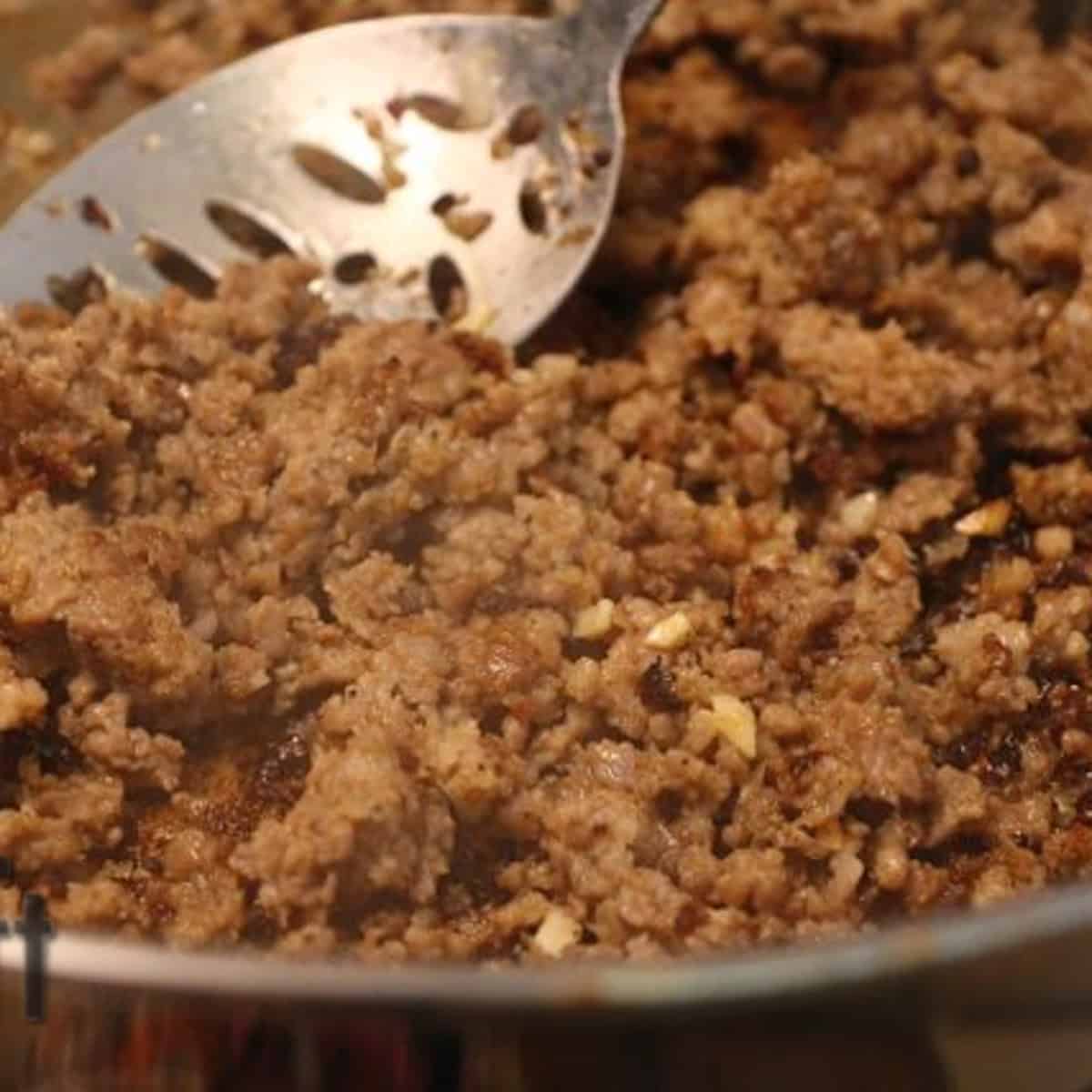 cooked sausage in a pan for stuffing.