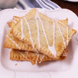 three toaster pastries on a white plate.