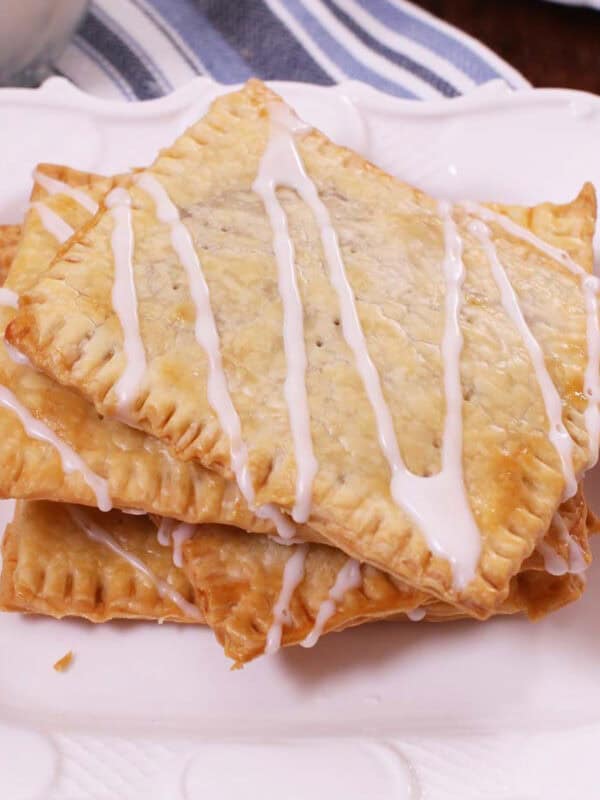 three toaster pastries on a white plate.
