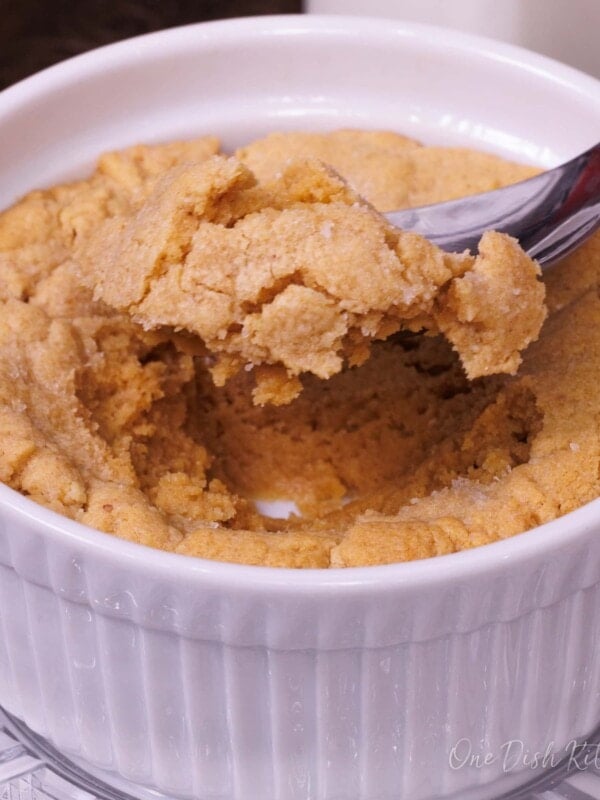 a peanut butter cookie eaten with a spoon from a small ramekin