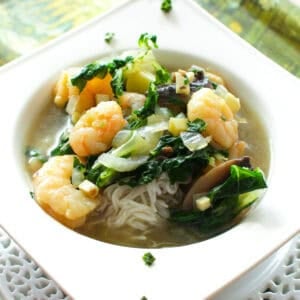 a small bowl of thai shrimp soup.