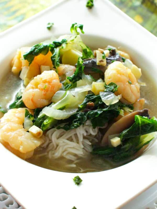 a small bowl of thai shrimp soup.