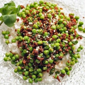 Spicy Chorizo Peas on a glass plate.