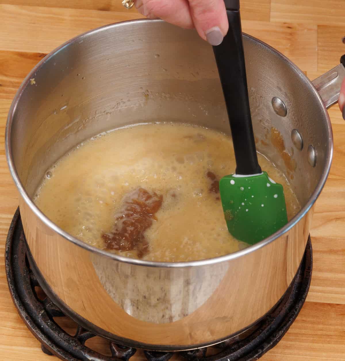 sugar seizing in a saucepan when cold cream is added