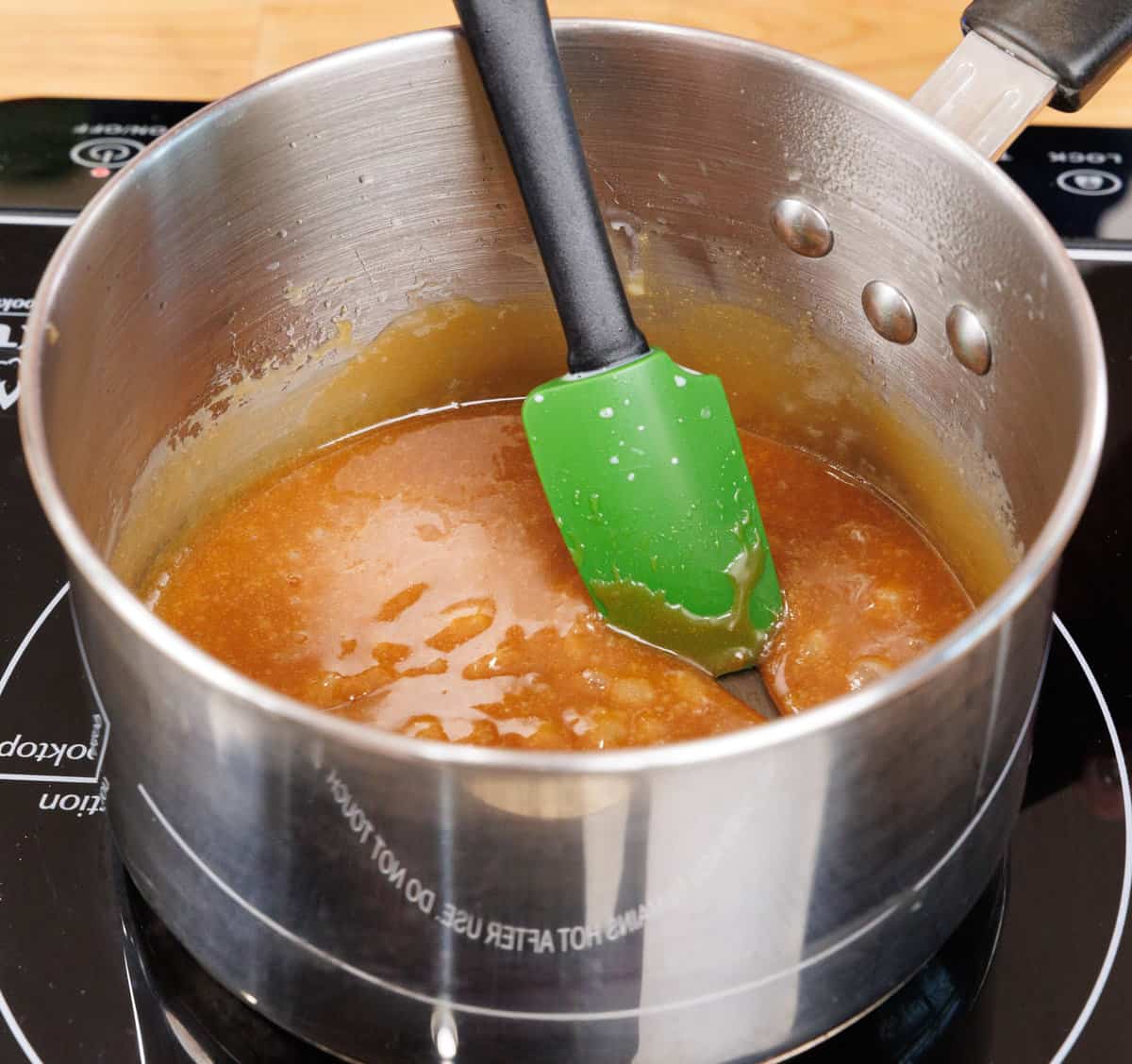 A pot of caramel on the stove