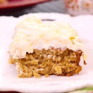 a slice of pineapple oat cake on a white plate.