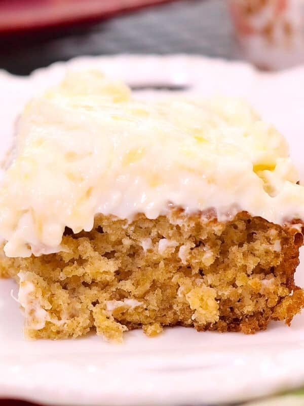 a slice of pineapple oat cake on a white plate.