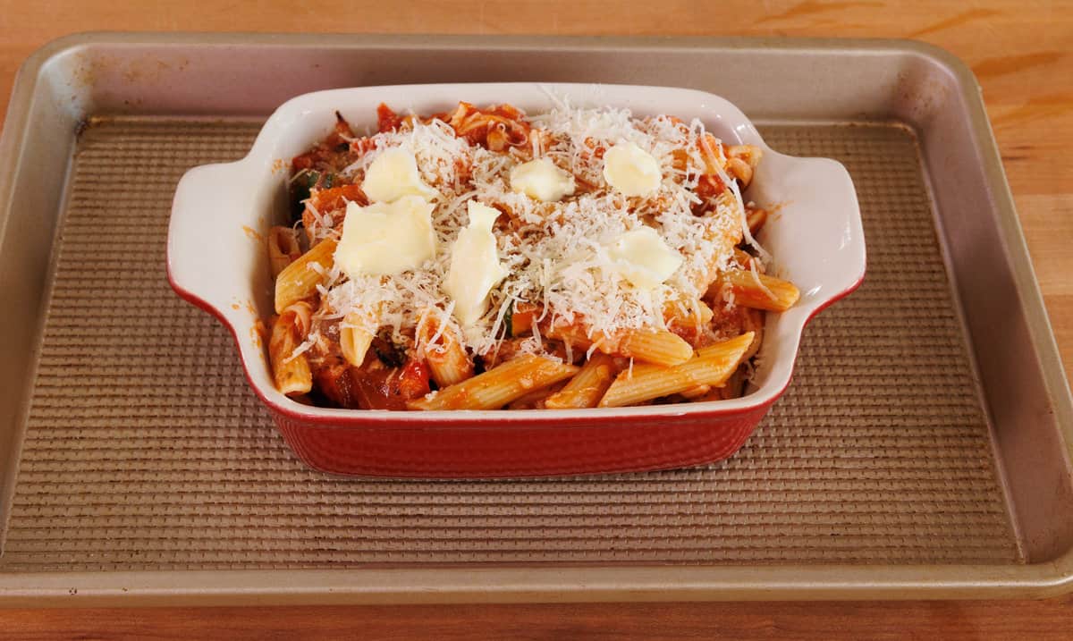 pasta casserole in a small red baking dish