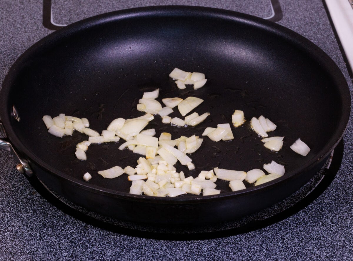 onions and garlic cooking in a pan