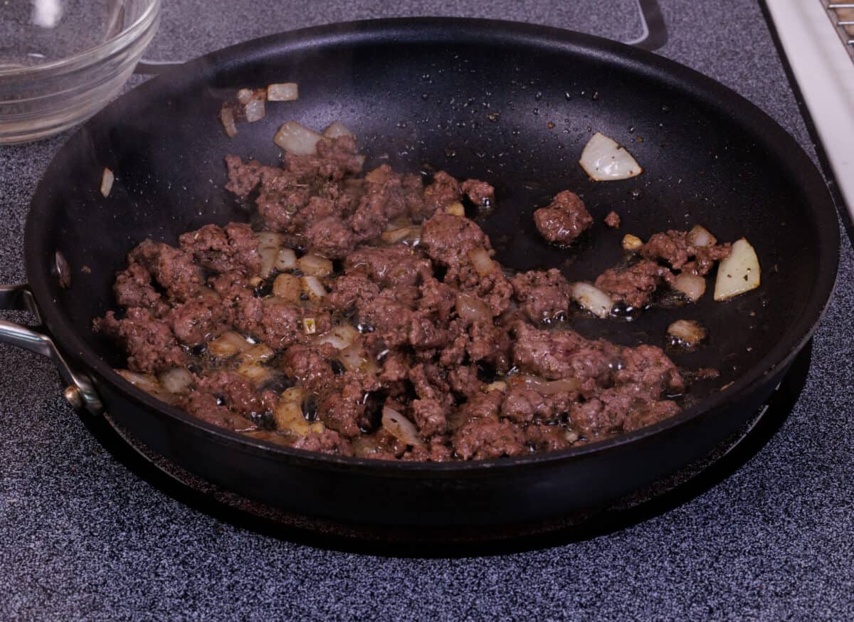 ground beef cooking in a skillet