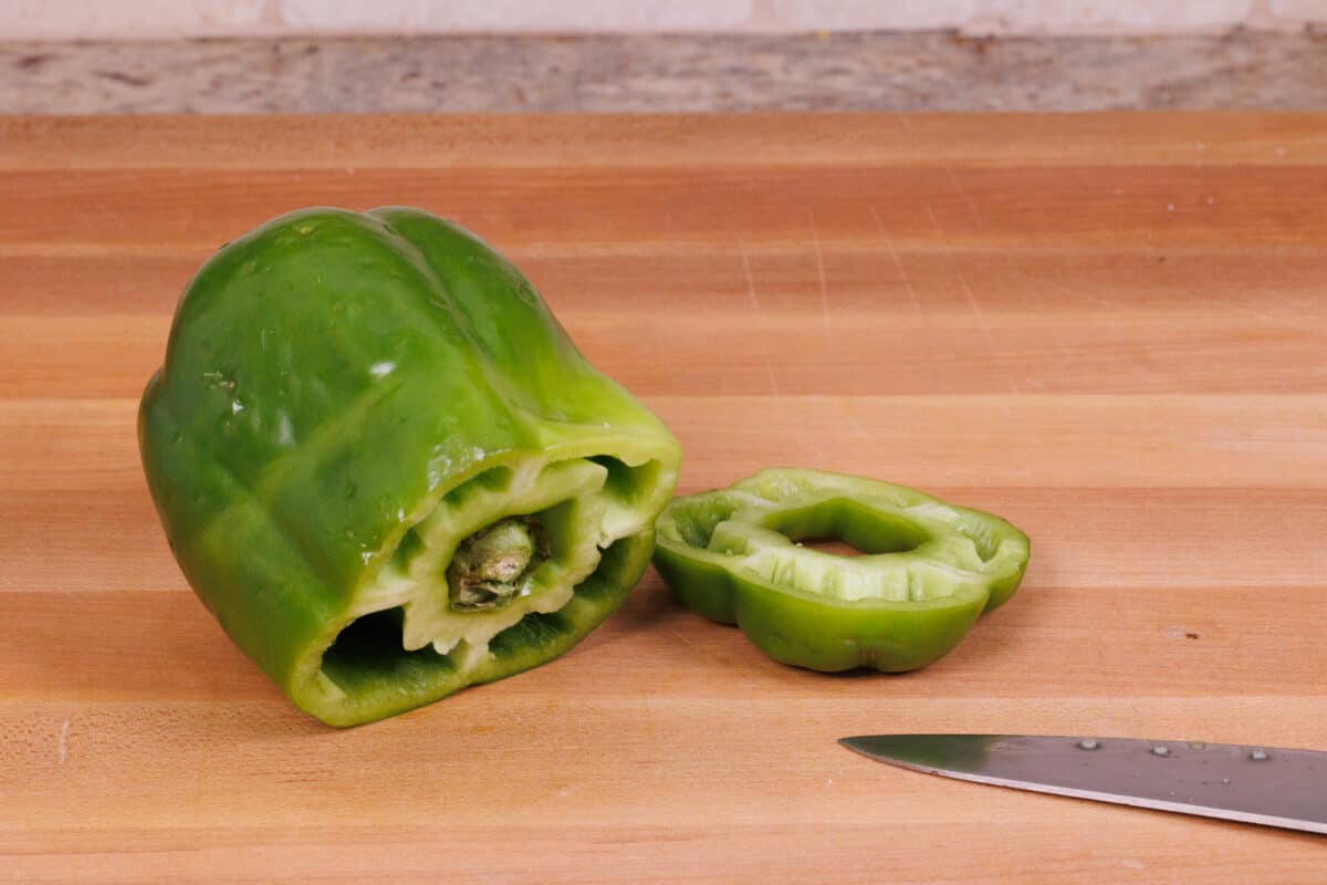 cutting the top of a pepper off
