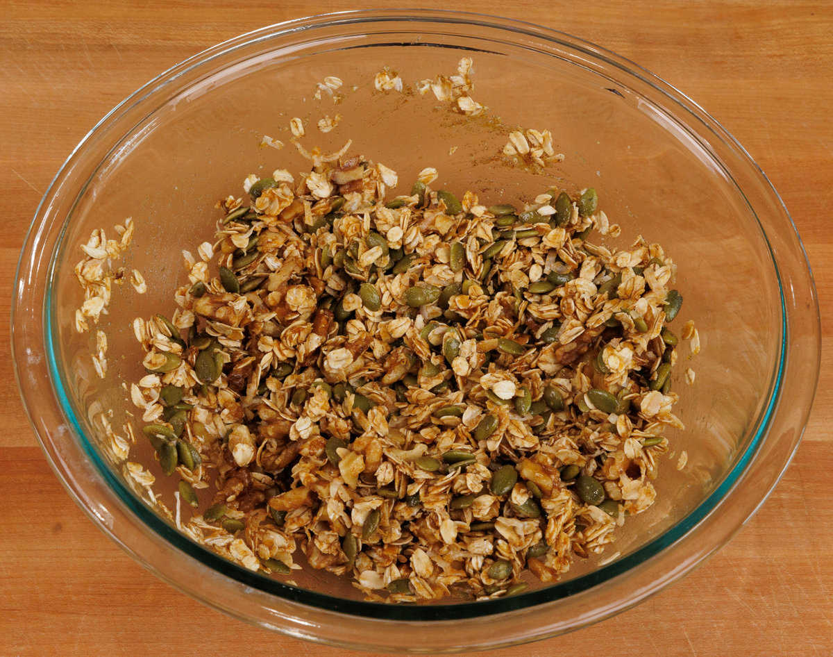 unbaked pumpkin spice granola in a mixing bowl