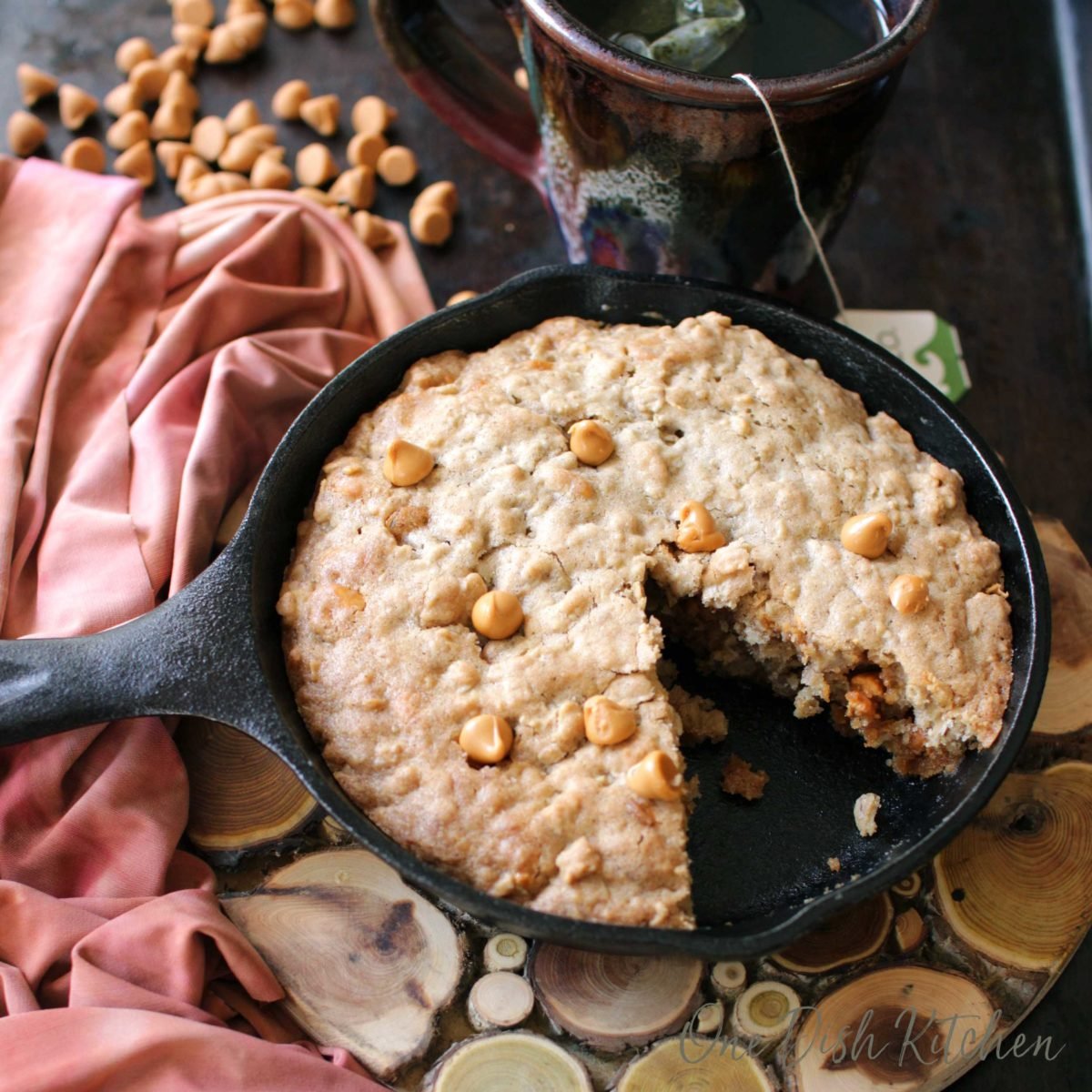 a small skillet with a butterscotch oatmeal cookie baked inside.