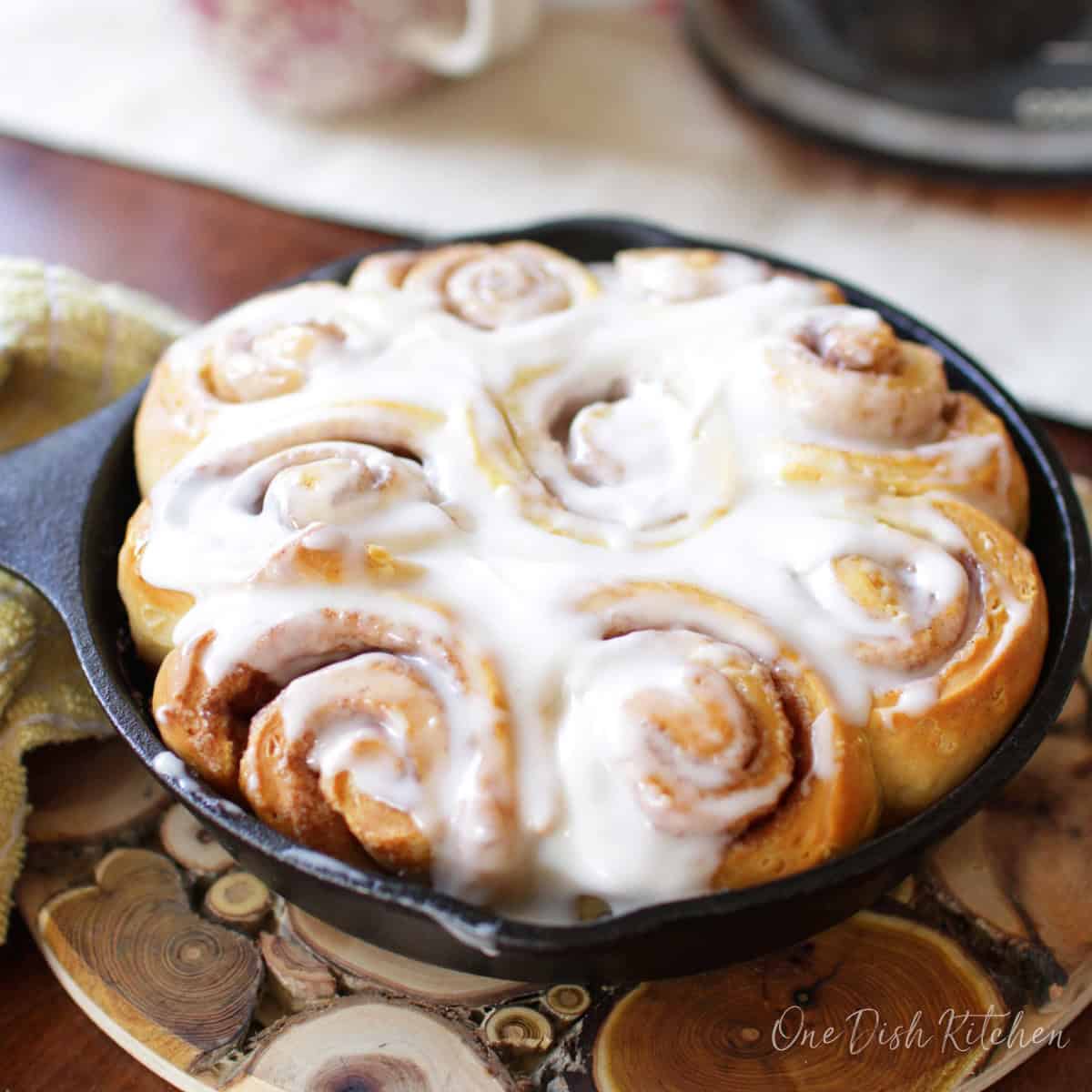 a small batch of cinnamon rolls made with refrigerator dough in a cast iron skillet.
