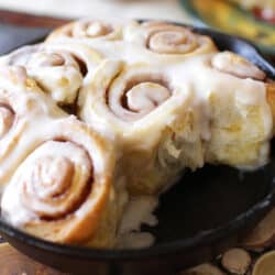 a small cast iron skillet filled with homemade cinnamon rolls