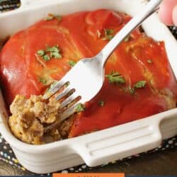 a mini bacon cheeseburger meatloaf in a white square baking dish with a fork on the side.