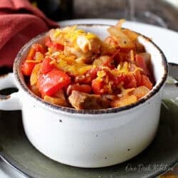 a single serving of chicken chili made with rotisserie chicken and topped with shredded cheese.