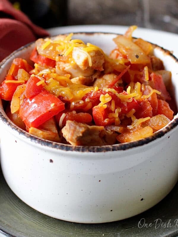 a single serving of chicken chili made with rotisserie chicken and topped with shredded cheese.