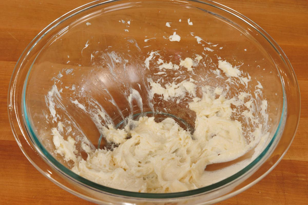 cream cheese and sugar whipped together in a mixing bowl