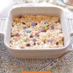 a single rice krispie treat in a square dish topped with M&M candies.