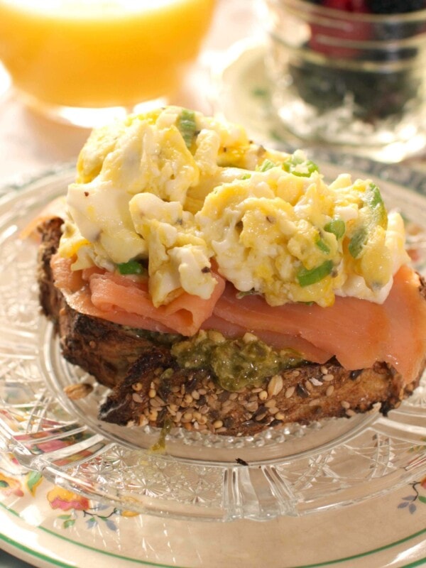 smoked salmon and scrambled eggs over a piece of crusty french bread