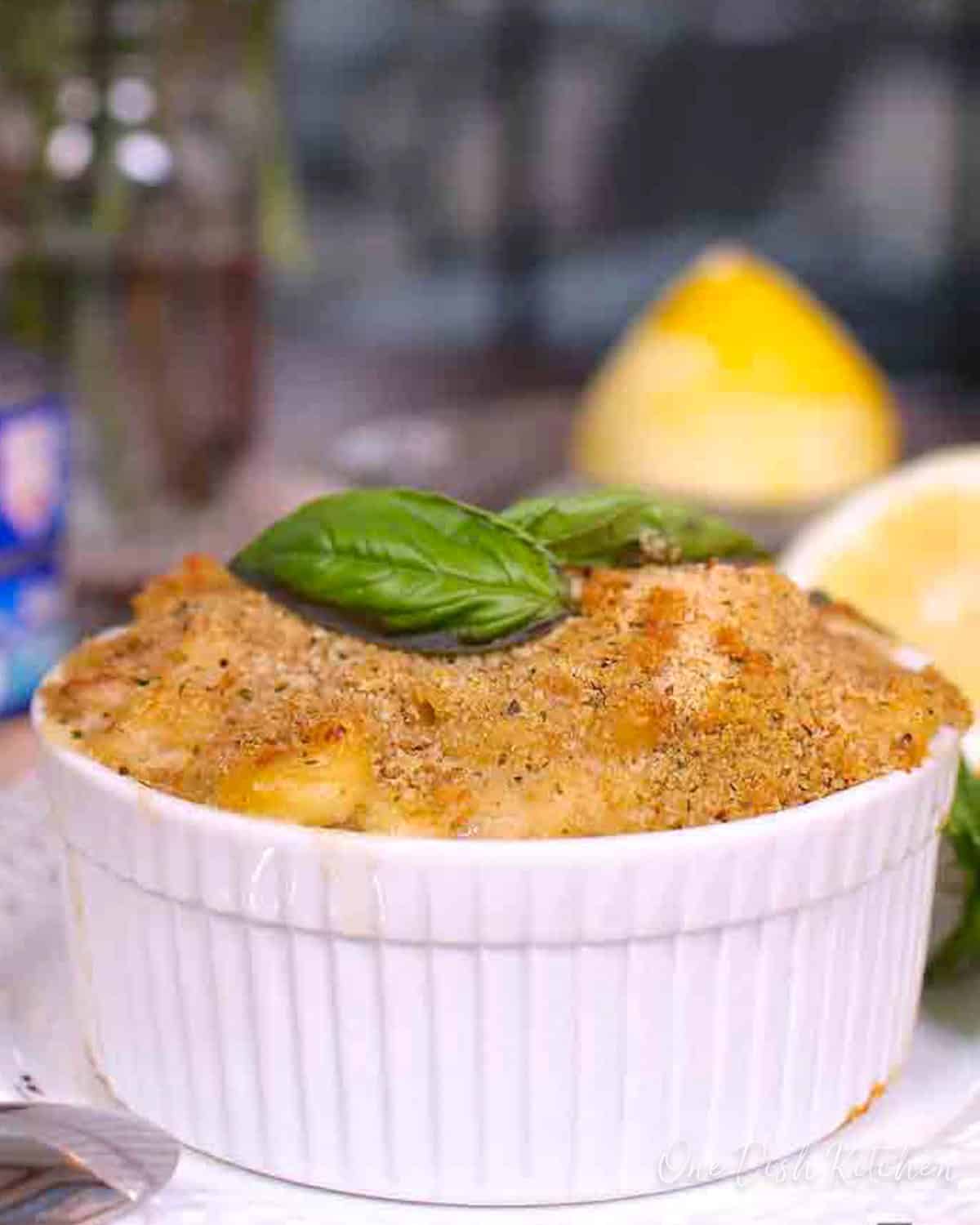an individual tuna casserole topped with breadcrumbs in a small ramekin.