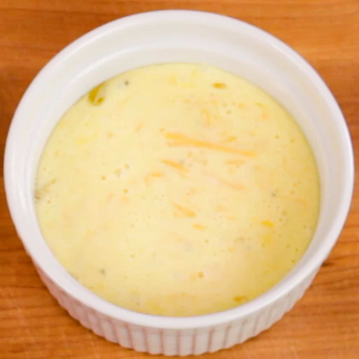 egg and cream mixture in a ramekin.