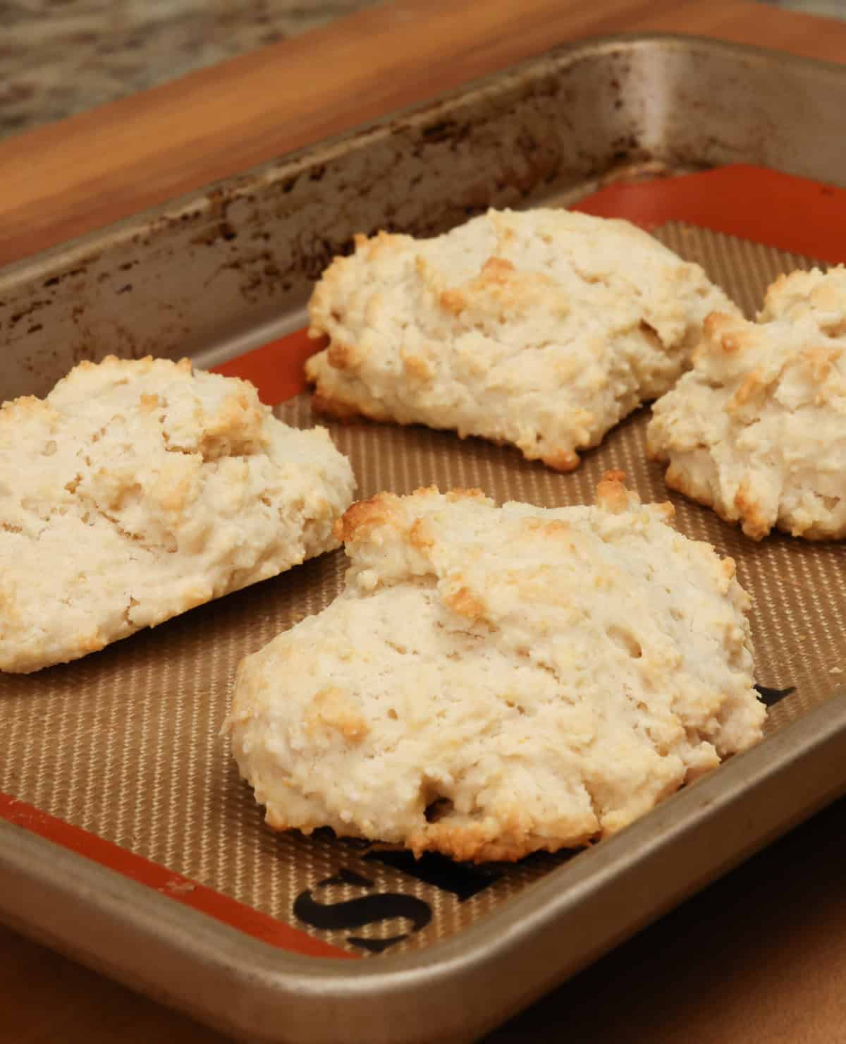 baked drop biscuits on a baking sheet.