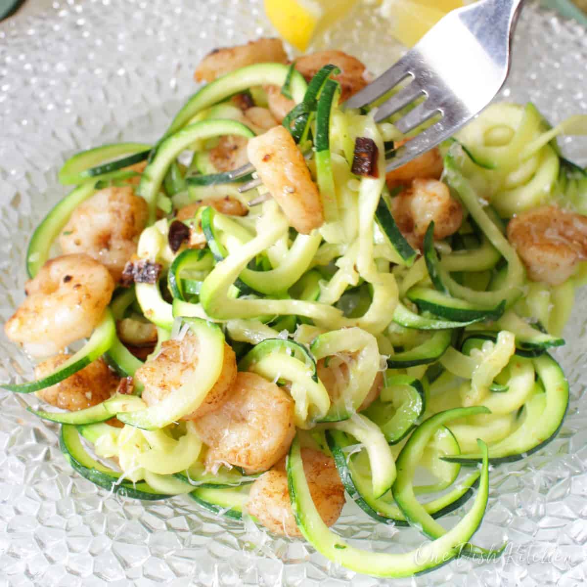 a bowl of zucchini noodles with shrimp.