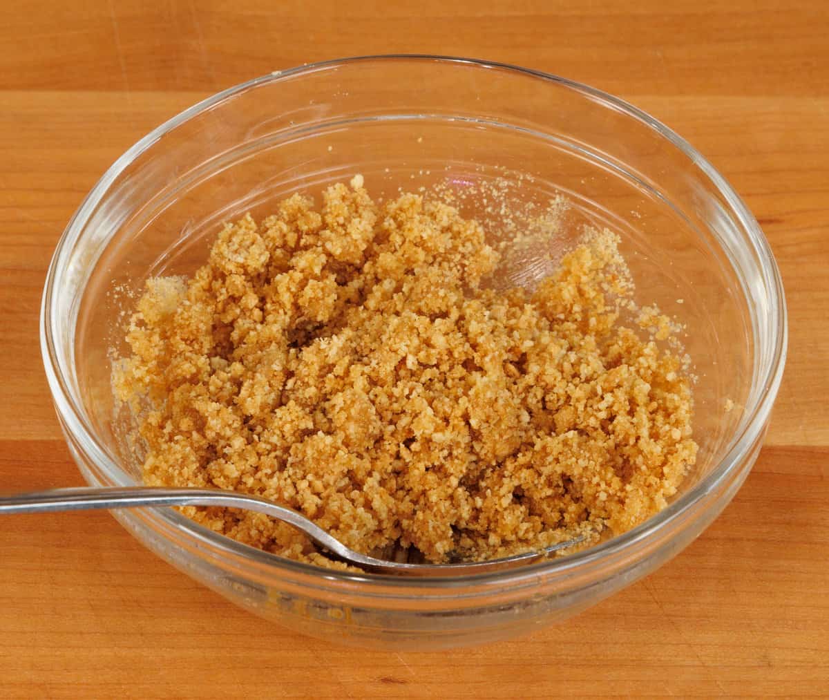 graham cracker crumbs and melted butter in a small bowl