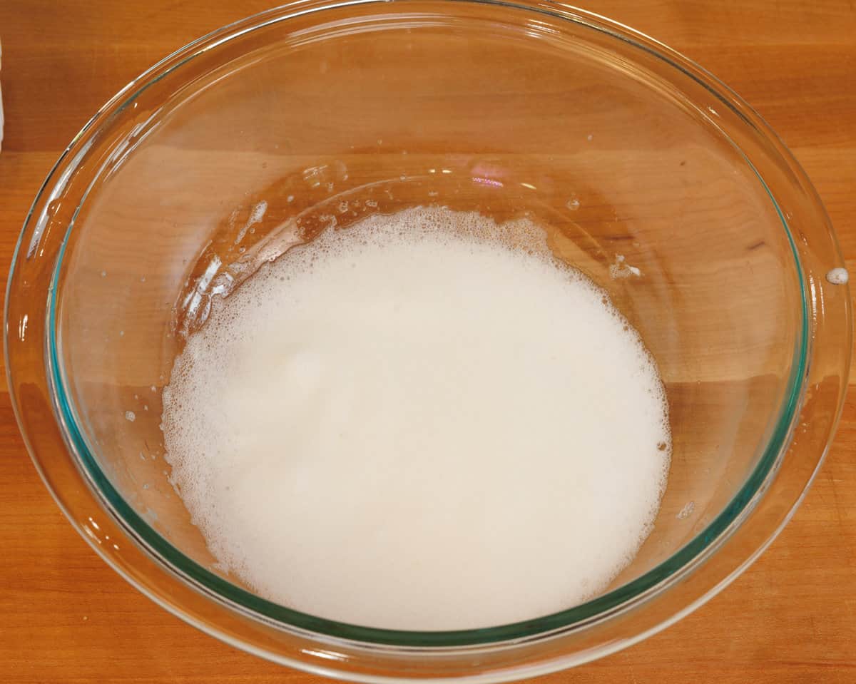 foamy egg whites in a mixing bowl