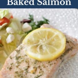 a baked salmon fillet topped with a slice of lemon.