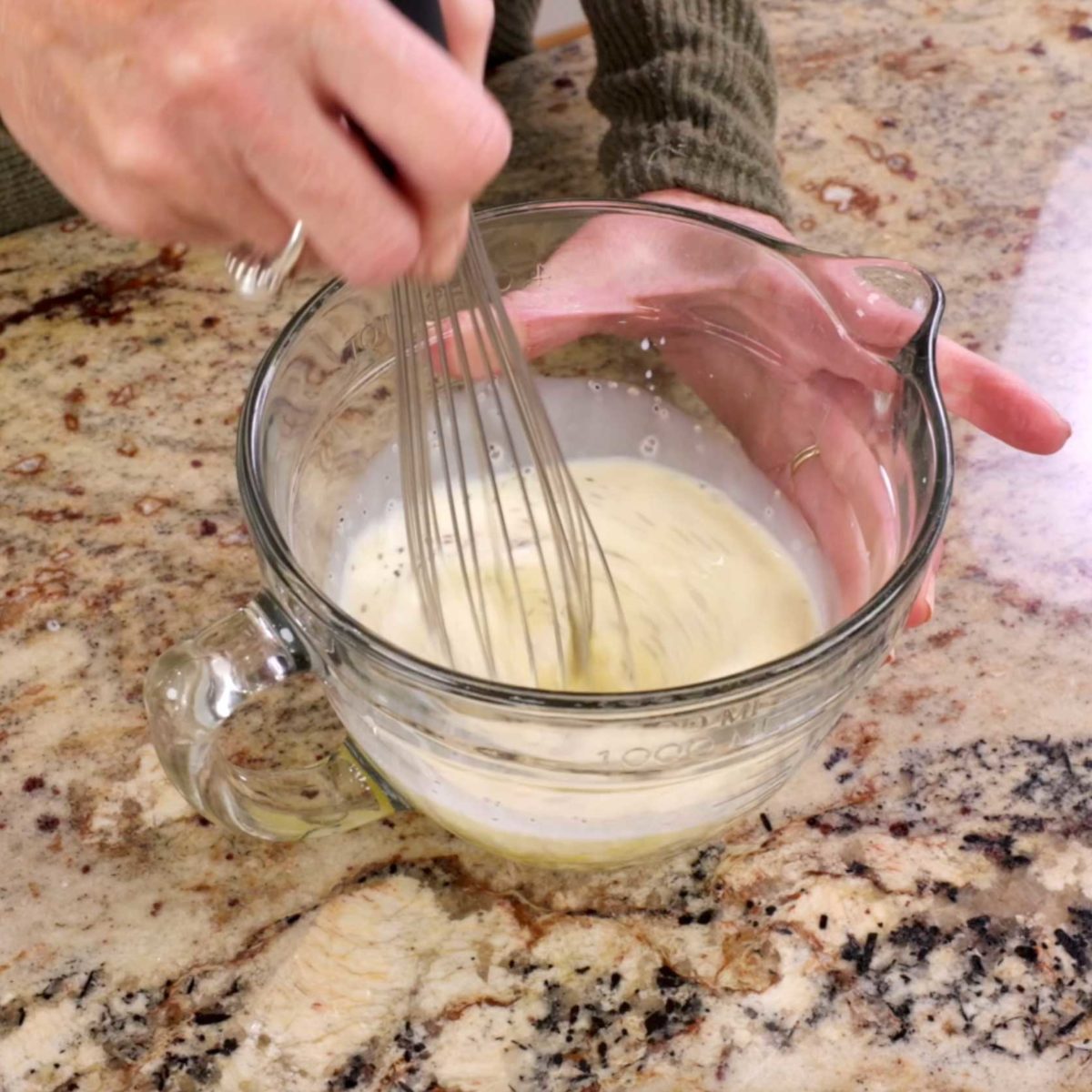 milk and eggs whisked together in a small mixing bowl.