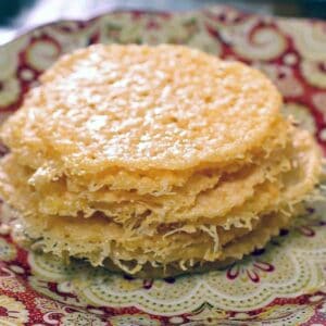 Parmesan Cheese Crisps stacked on a plate.