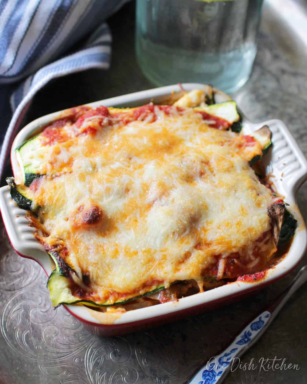 A mini zucchini lasagna in a small baking dish.