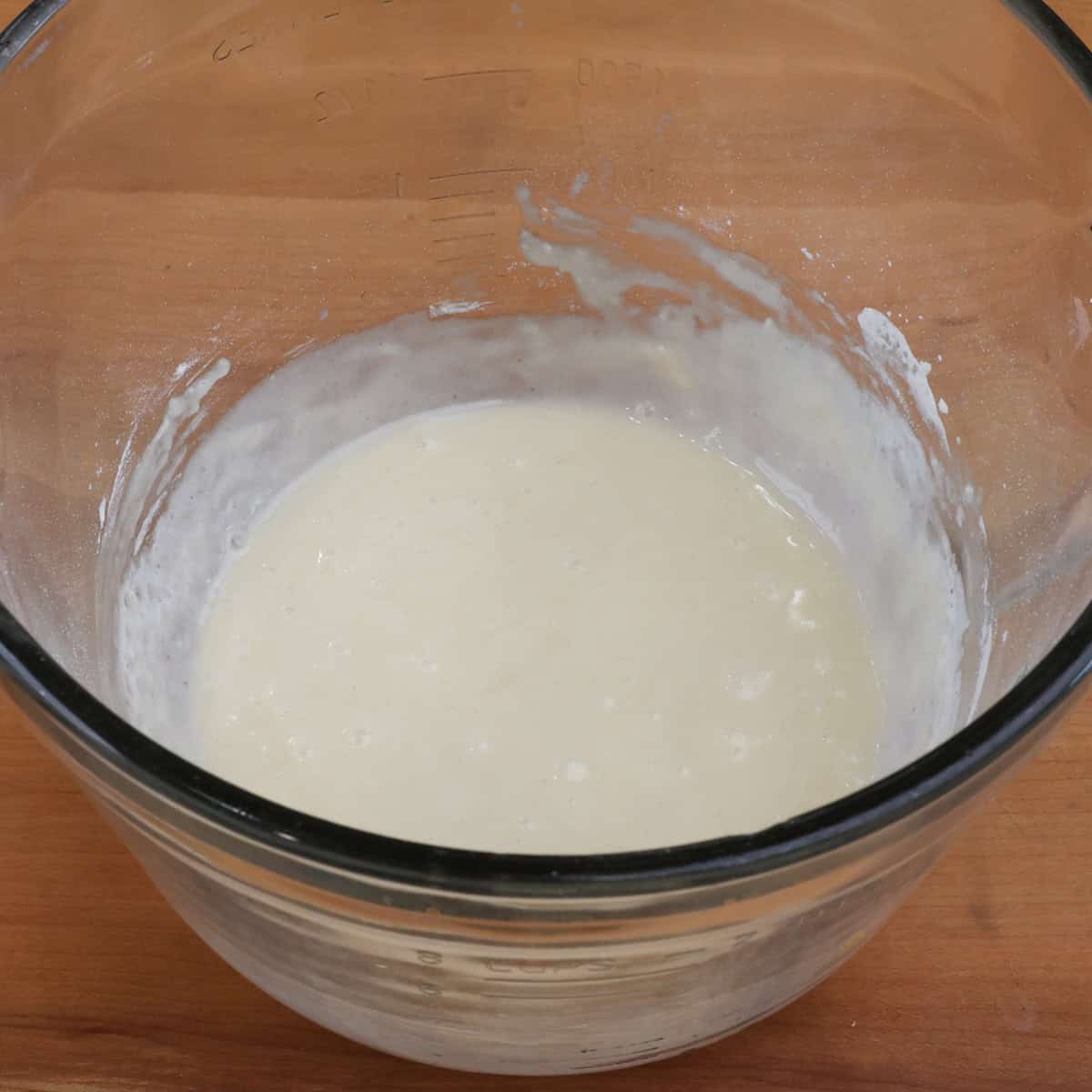 a small batch of vanilla cupcake batter in a mixing bowl.