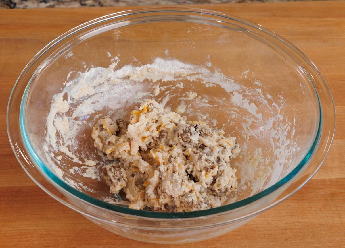sausage and cheese beer bread batter in a mixing bowl